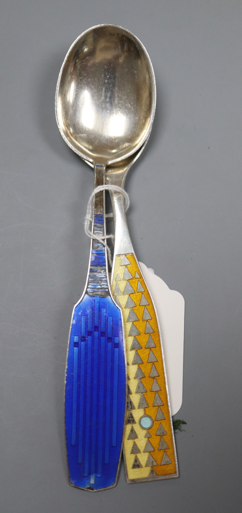 Two 1960s Danish sterling and enamel spoons by A. Michelsen, gross 98 grams.